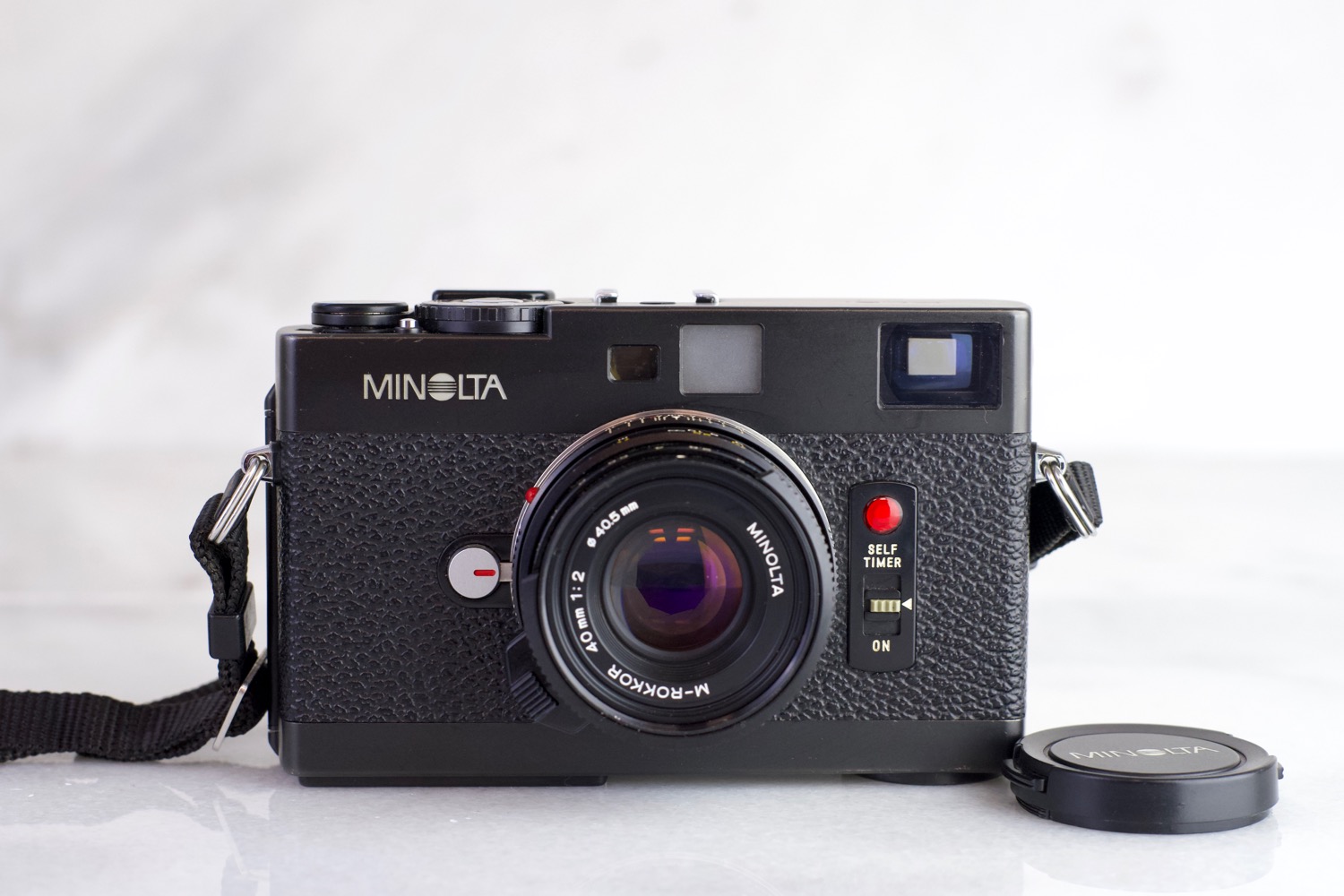 Minolta CLE with Minolta M-Rokkor 40mm F/2 Lens, Lens Cap Minolta CLE with Minolta M-Rokkor 40mm F/2 Lens, Lens Cap